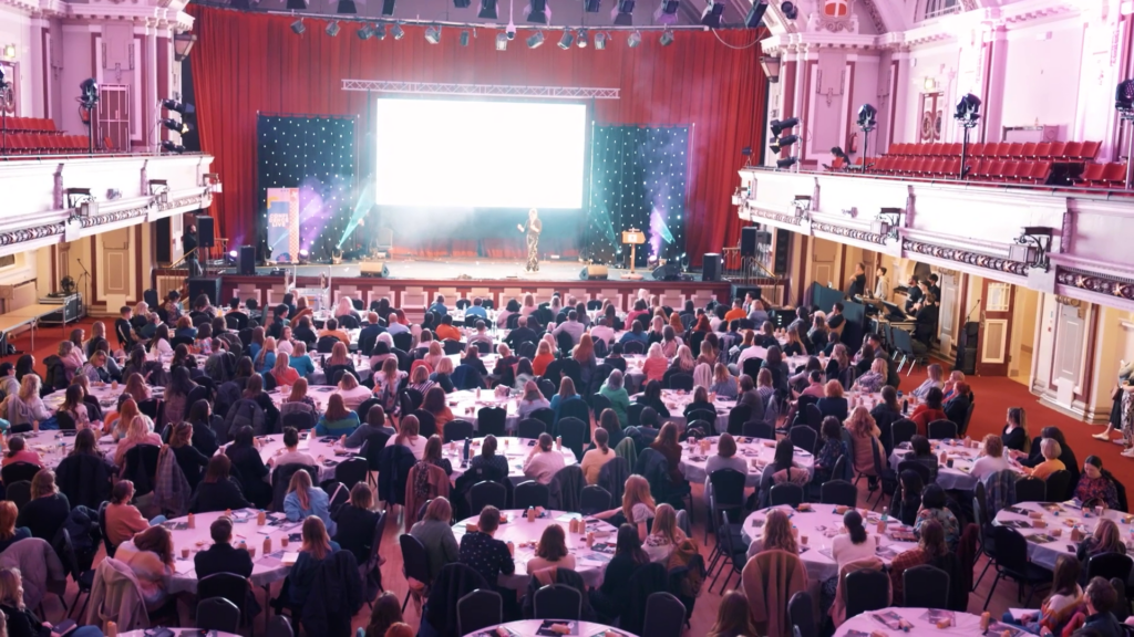 Event Tables in front of big screen